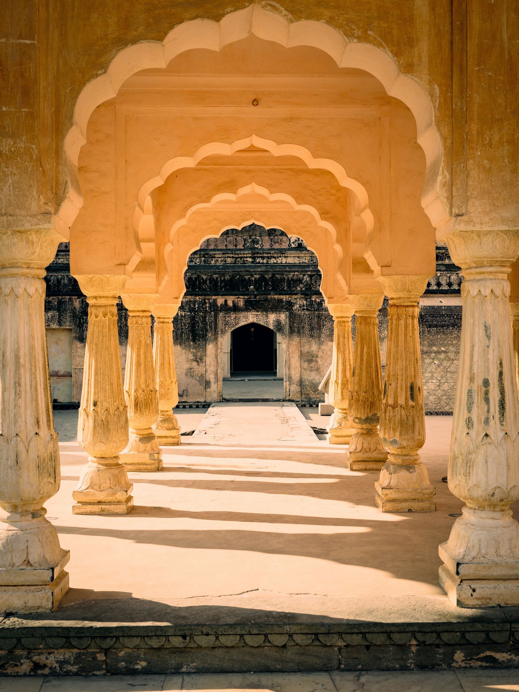 Repeating Pale Gold Arches And Arcade